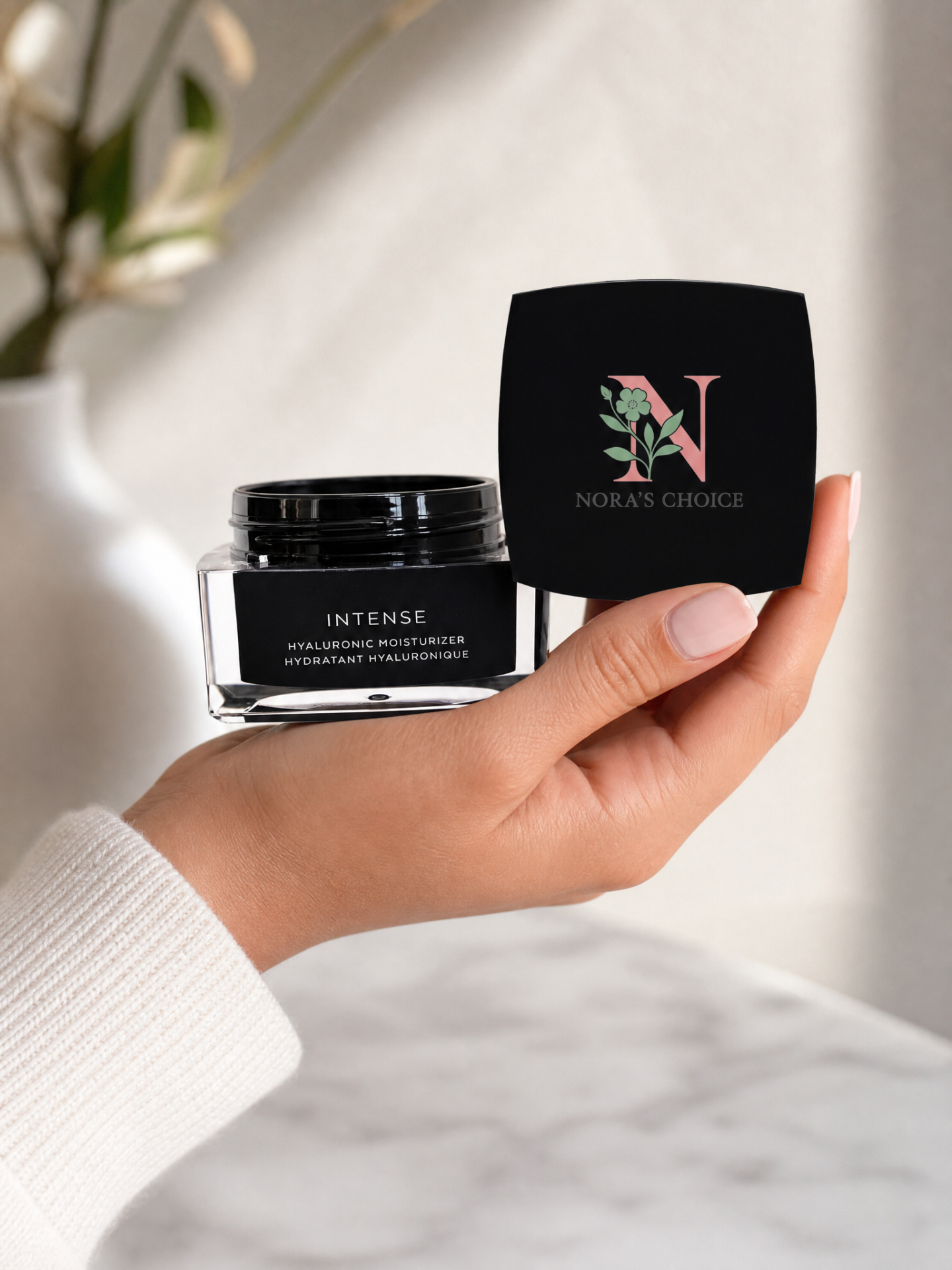 Model holding Intense Hyaluronic Moisturizer